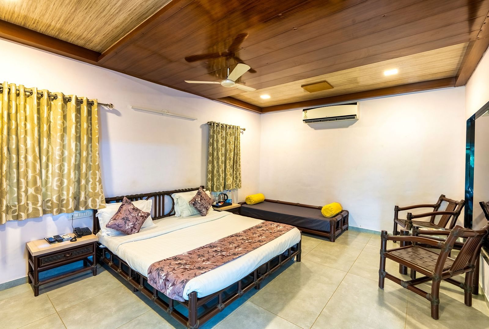 A room with with a double bed and seating arrangement at Saavaj Resort
