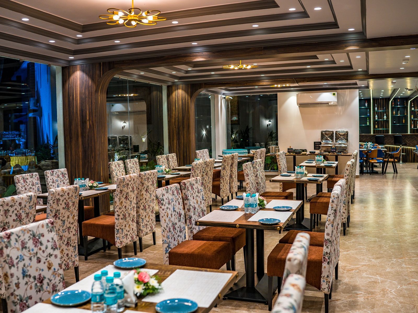 seating arrangements inside the in-house restaurant - The Tanisi Hotels & Resorts, Goa