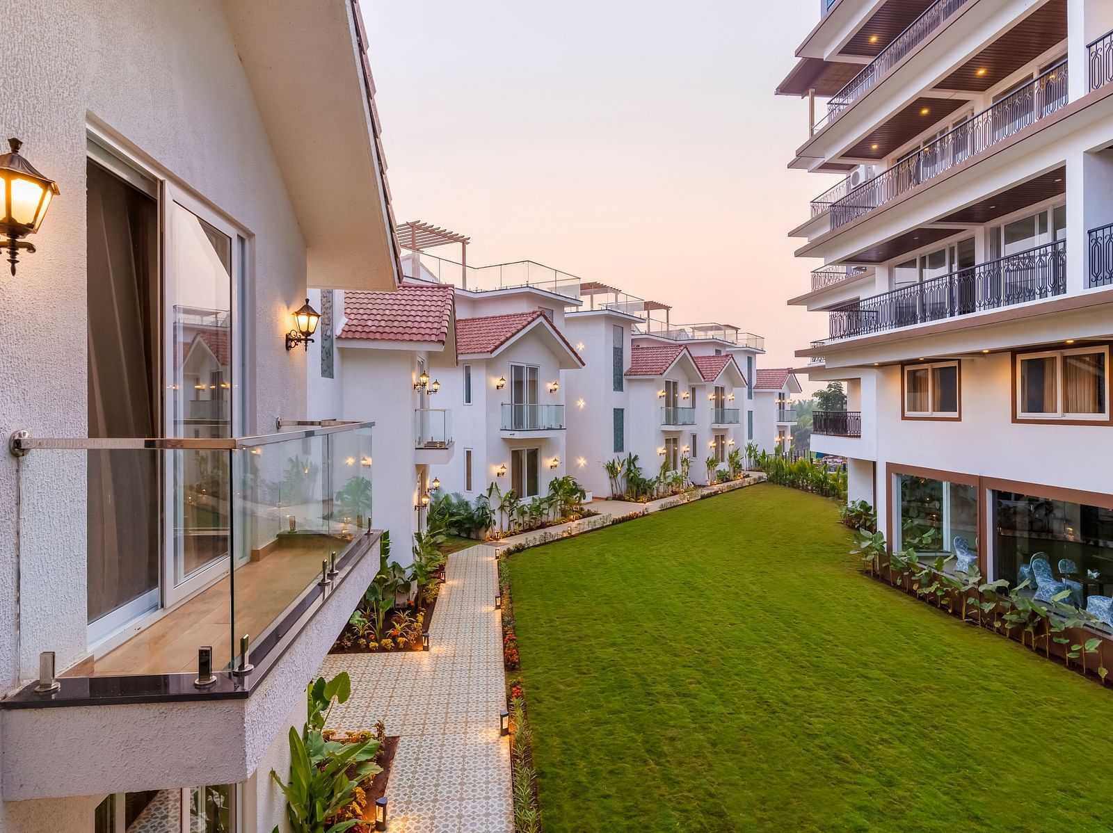 Rooms view with a manicured garden in front of it - The Tanisi Hotels & Resorts, Goa