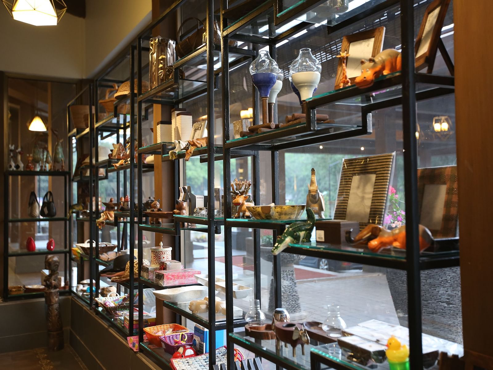 an image of a store with artefacts on window display - Rhythm Lonavala