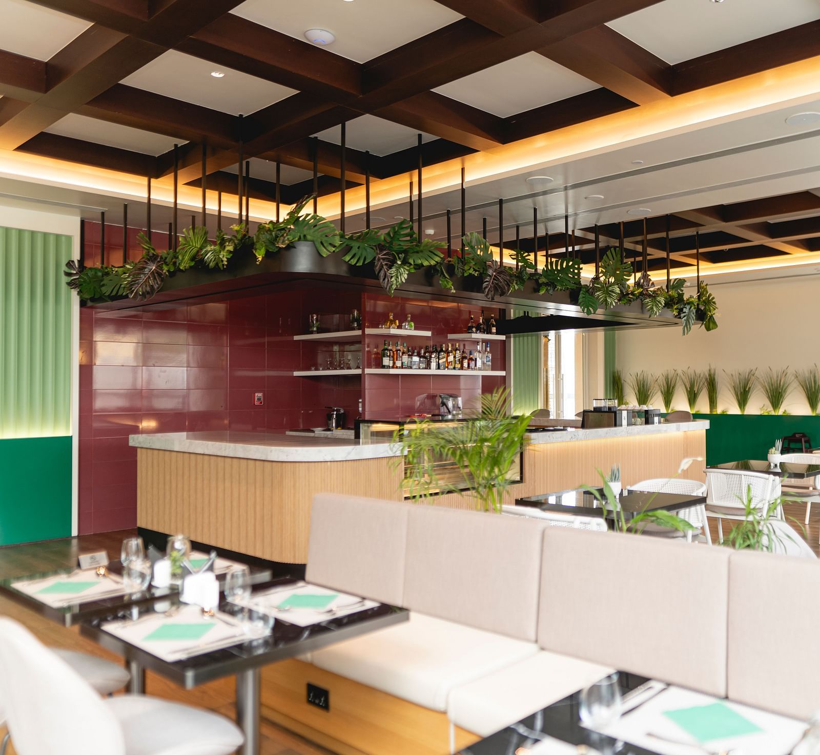 Meli-Melo Restaurant at KertelSuites, featuring elegant seating arrangements and stylish ceiling lights