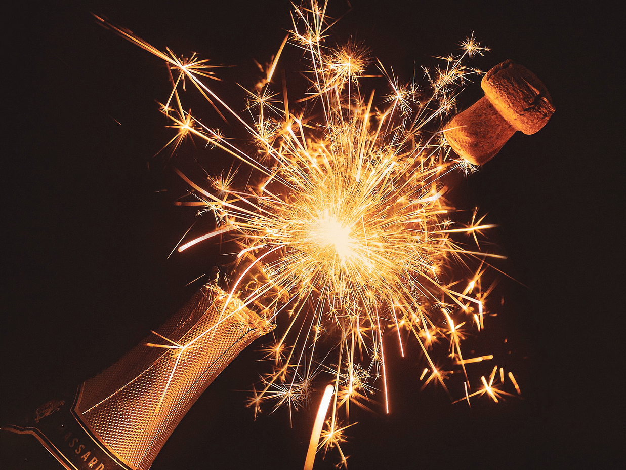 Sparks coming out of a champagne bottle