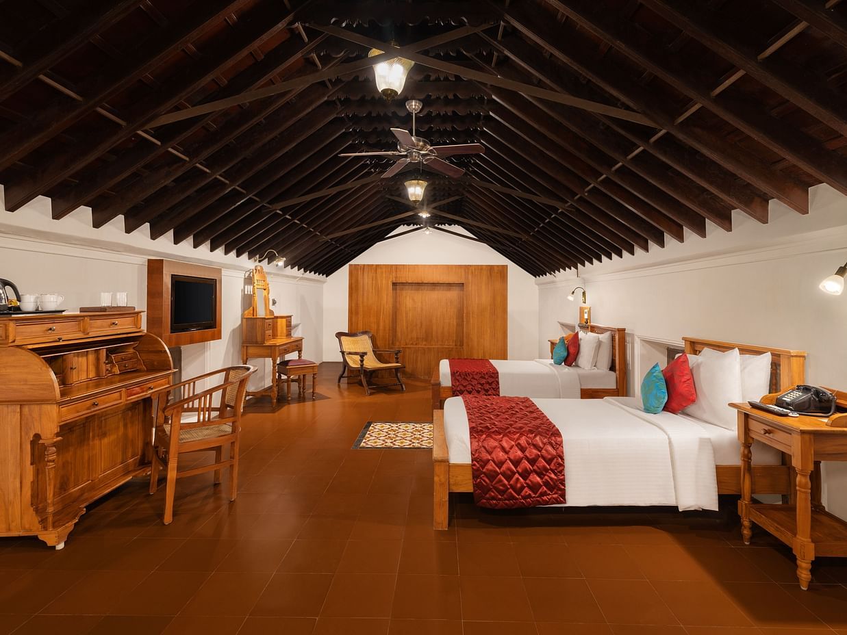 Double bed and wardrobe in Luxury Room at Chidambara Vilas 