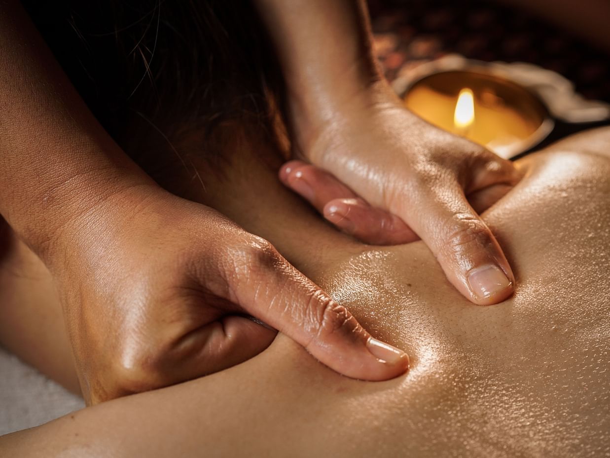 An image of a women getting an oily neck massage 
