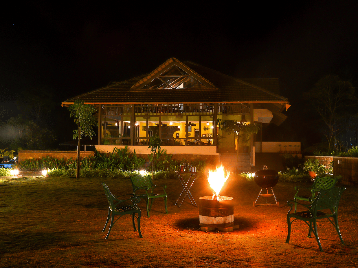Bonfire evenings at Machaan plantation resort