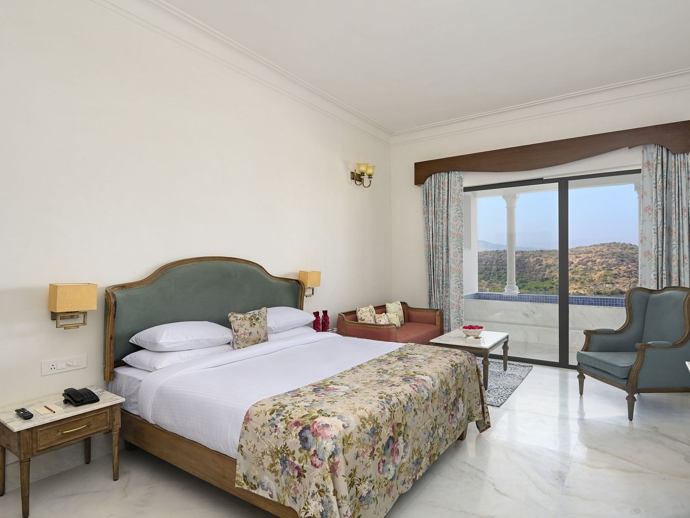 Fateh Vilas Udaipur - Interior view of the Punge Pool Suite featuring a queen size bed white decor and a plunge pool