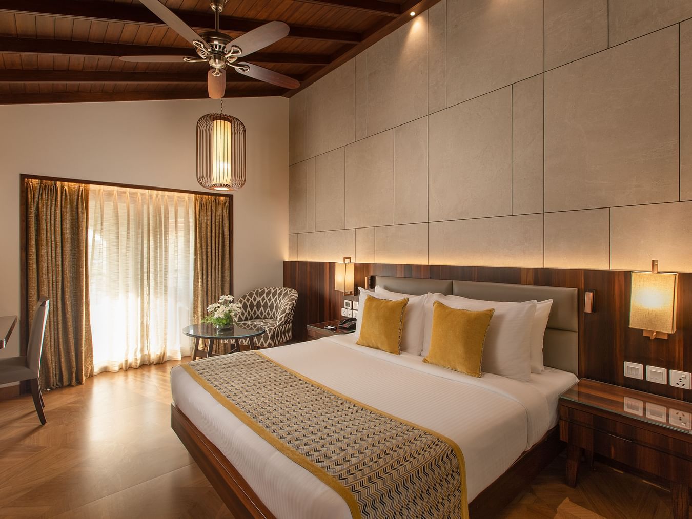 An image of the Ocean View King Room with a king size bed, bed side table, lamps and other amenities - Kenilworth Resort and Spa