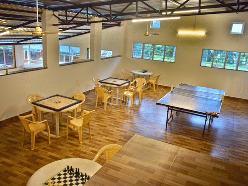 Picture featuring a room with the indoor games