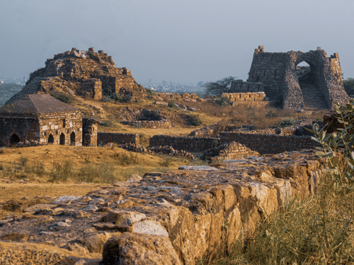 Ruins of an ancient fort under an overcast sky.