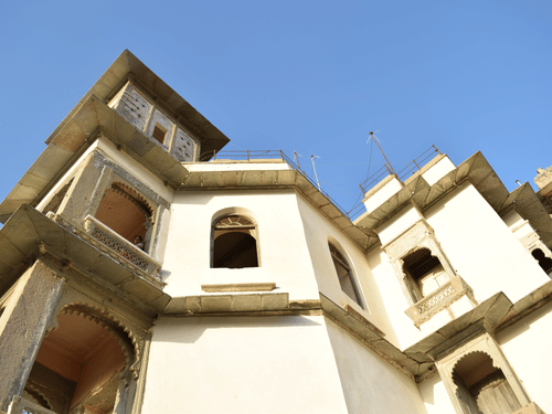 A bottom view of a cream coloured building 