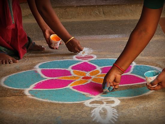 People making a rangoli at Chidambara Vilas