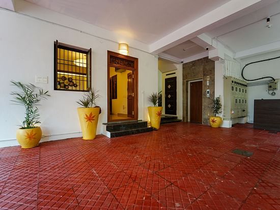 Entrance to the reception with potted plants next to it - La Tamara Luxury, Pondicherry