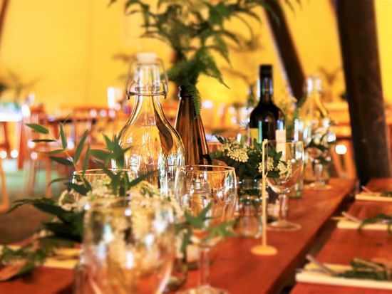Image of a table with a lot of glasses and glass bottles on a table - Stone Wood Mountain Resort, Dharamshala