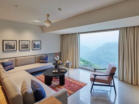 Image of a sitting area with a large window overlooking the valley at The Dukes Retreat.