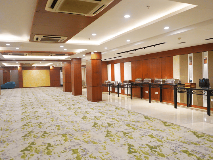 The versatile conference room at Nemesia offers a flexible layout, suitable for various meeting configurations, with a buffet attached.