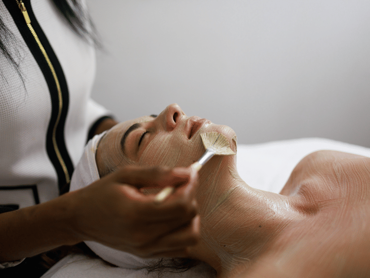 A woman receiving spa service at The Soco House.