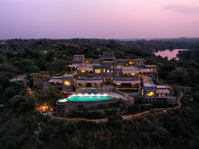 An aerial view from a drone of Chunda Shikar Oudi with the swimming pool in full view. 