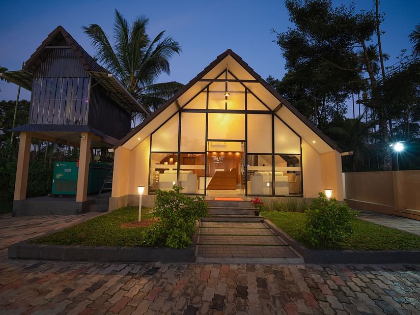 Night view of property with tress behind it at Feel Free Retreat, Wayanad