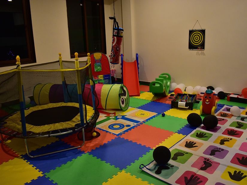 kids play area with toys and miniature rides with colourful flooring - Hotel Montana Vyoo