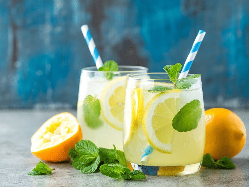 Two delicious looking drinks made of lime kept aesthetically