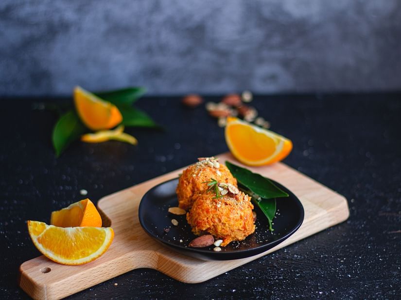 a dish with orange slices next to it for aesthetic presentation