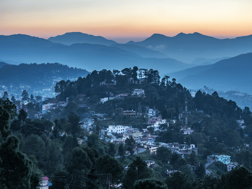 Panoramic view of Almora Hill town surrounded by layered Himalayan Ranges