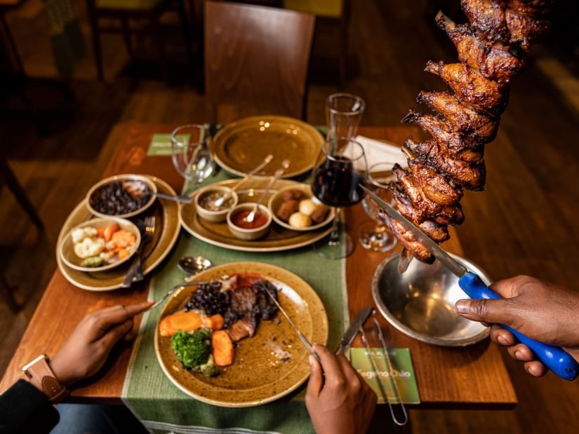 A view from the top of the many items placed on a table inside the restaurant - Ramada by Wyndham Addis, Addis Ababa.