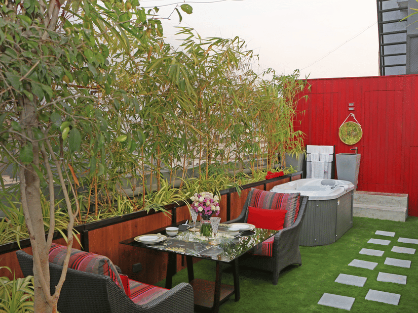 Rooftop terrace with hot tub and dining at Theory9 - Premium Service Apartments, Bandra.