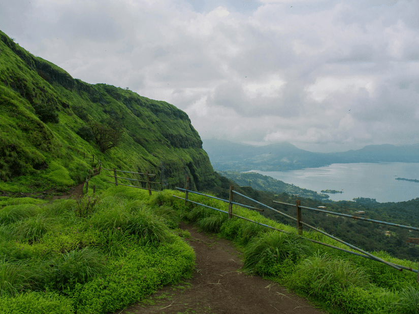 Panoramic view from a trek to Lohagad Fort, one of the popular things to do in Lonavala, under a cloudy sky