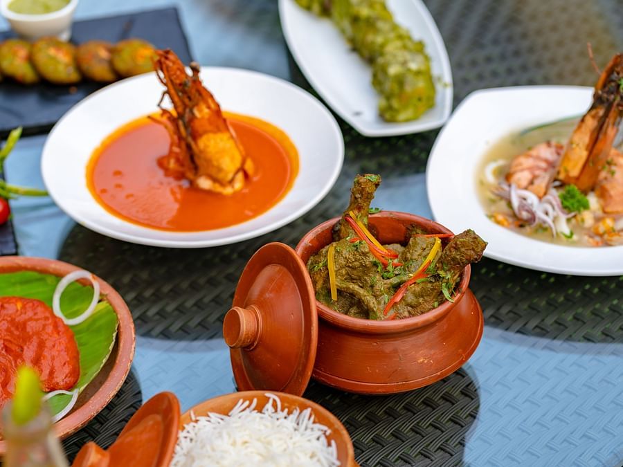 An image of a dining table, adorned with an array of seafood dishes