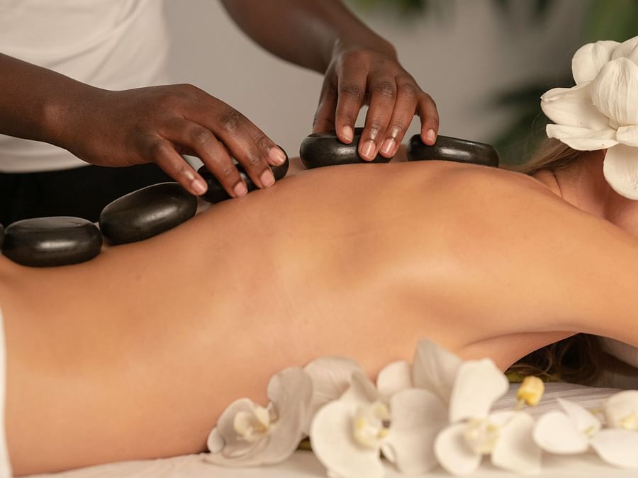 a person exercising therapeutic massages on a lady