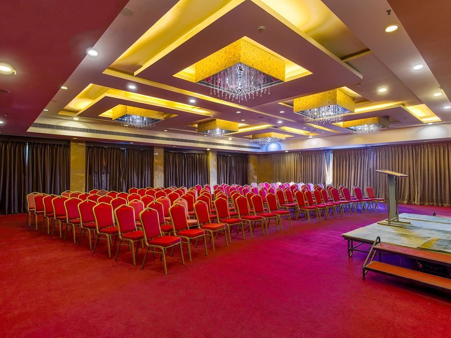 Banquet Hall at GIS Select furnished with red chairs and modern amenities