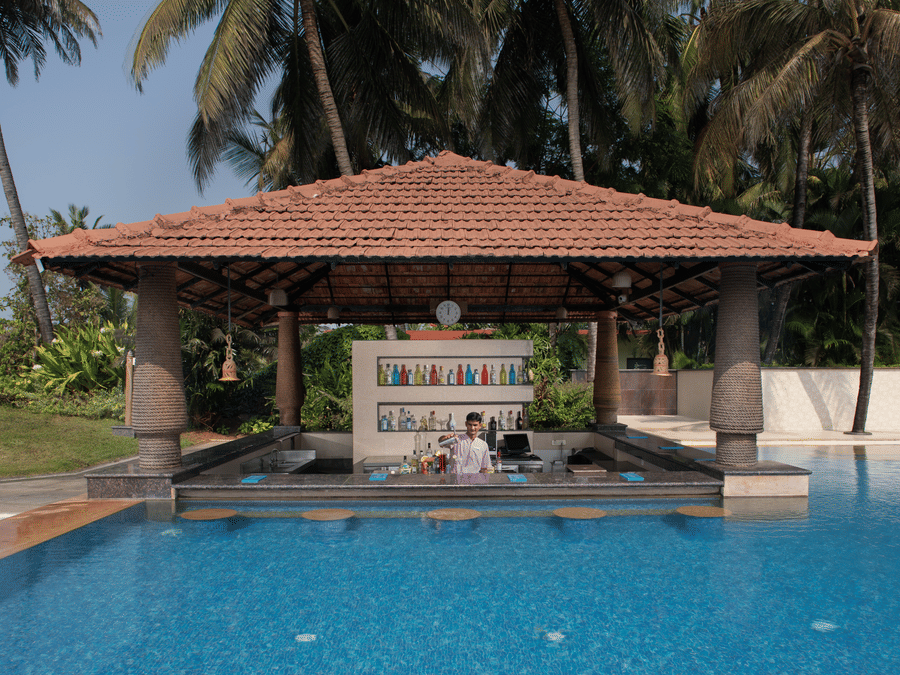 Aquarius, a pool-side cafe in South Goa, looks dream-like as it resembles a gazebo coming out of the pool in a lush green backdrop