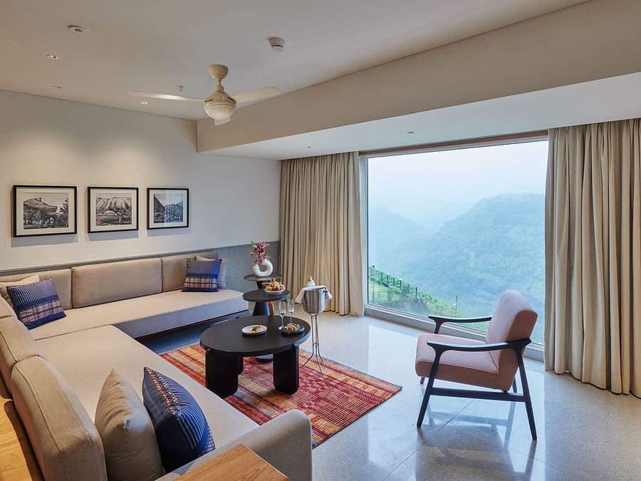 Image of a sitting area with a large window overlooking the valley at The Dukes Retreat.