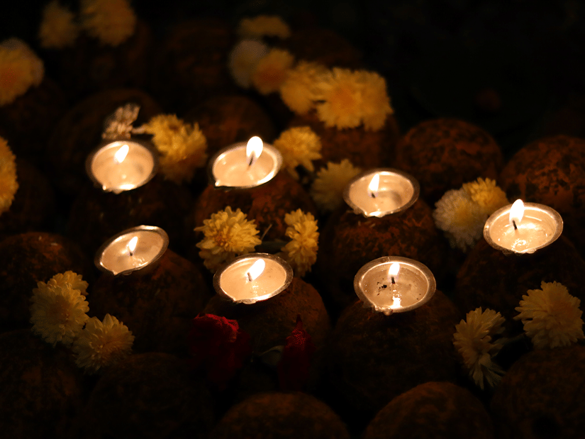 diyas lit up at night for a special occasion