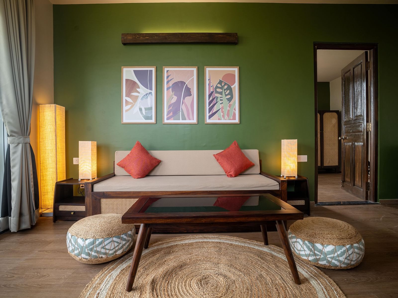 Chic living area with a wooden coffee table, pouffes, and contemporary wall art at Kssemya.