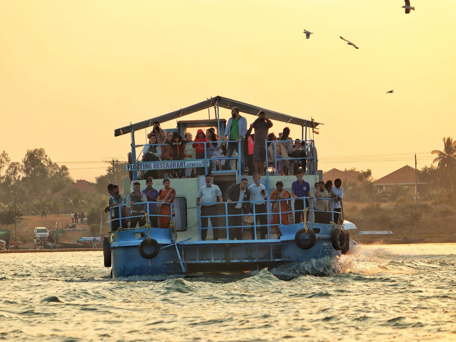 People on a ferry crossing a lake