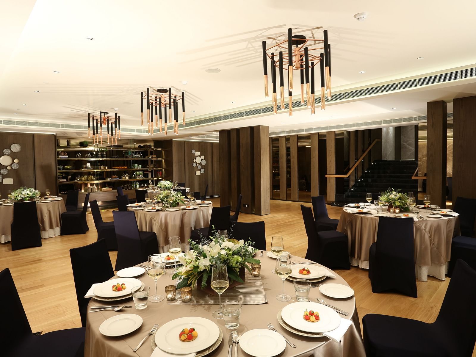 A stylish banquet hall with elegant table settings, ideal for upscale events at The Raintree, St. Mary's Road