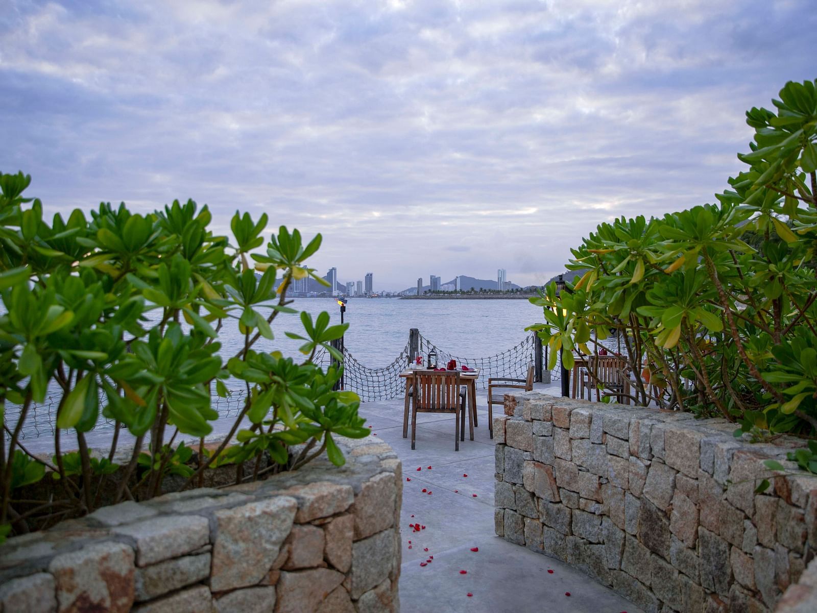 A pathway leading to the amazing scenic dining arrangement available by the sea - Alibu Resort Nha Trang