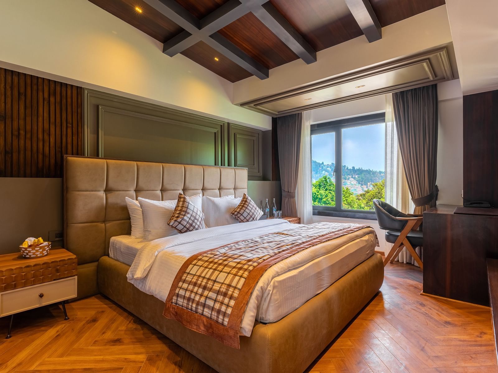 A bedroom with mountain view window at Bedzzz Xclusiv Ikshana Luxe