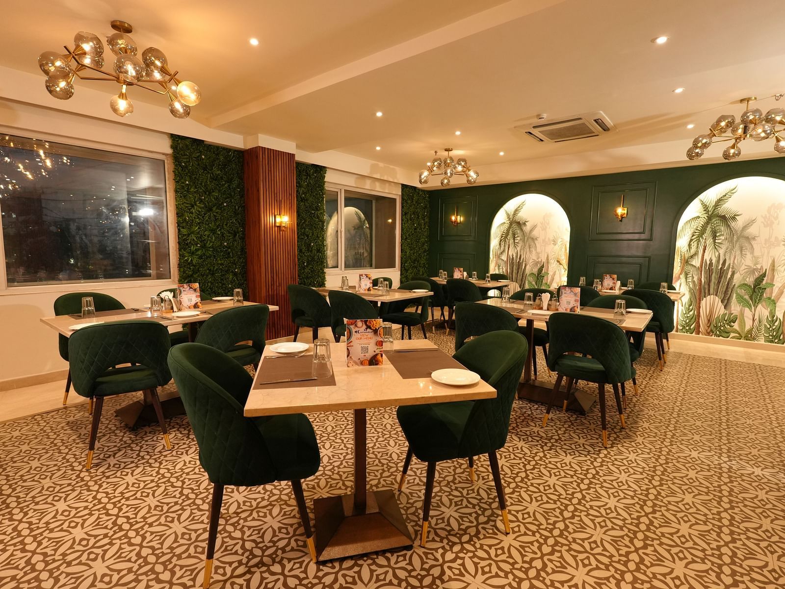 Contemporary dining area with elegant chairs and wall art - Grand Plaza Lords Inn Jammu