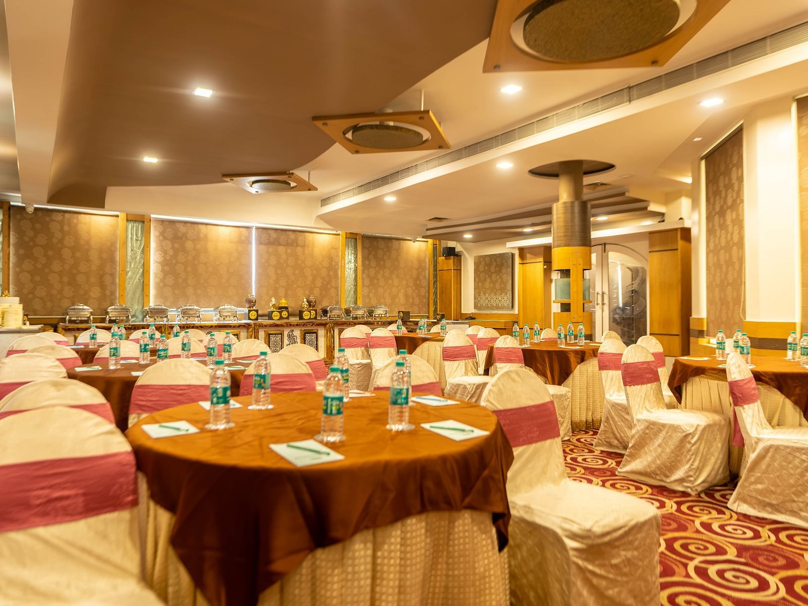 A banquet hall at Hotel Pai Viceroy Jayanagar in a wedding setup featuring ambient lighting