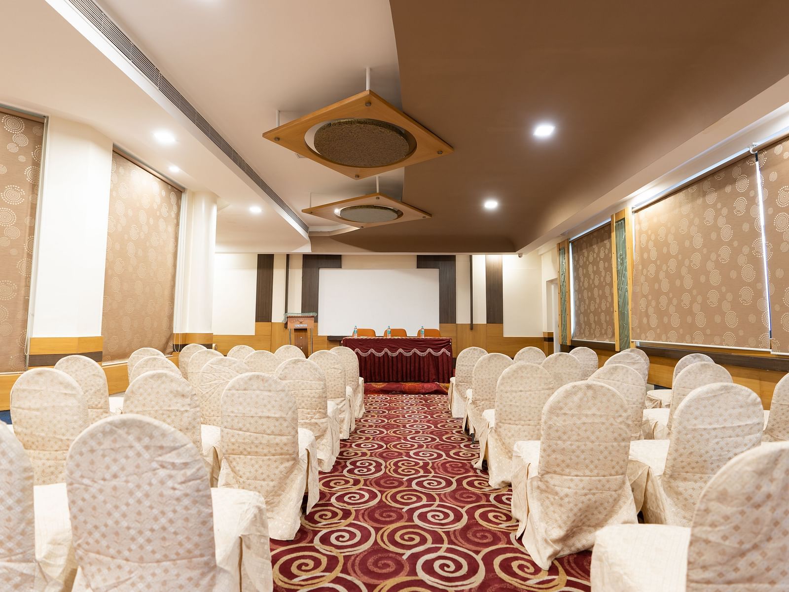 A banquet hall at Hotel Pai Viceroy Jayanagar in a threatre setup
