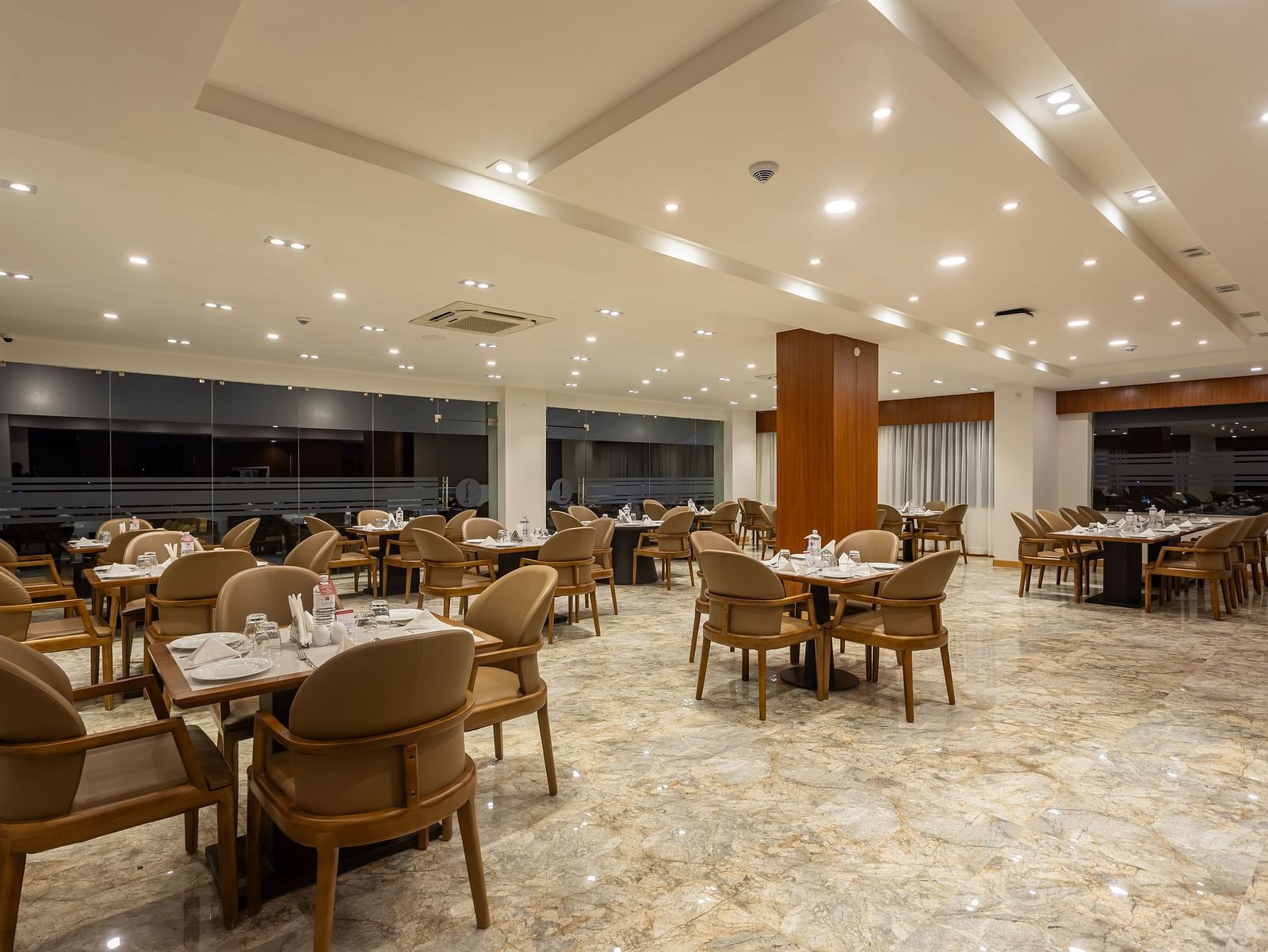 The Blue Coriander restaurant at Mandala Norling Lords Prime in Kathmandu featuring a fine dining seating arrangement and well-placed cutlery.