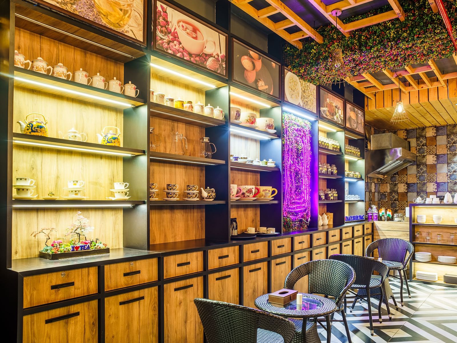 A wide shot of a restaurant at Orsino Spa Resort with walls lined with shelves filled with various items and bottles.