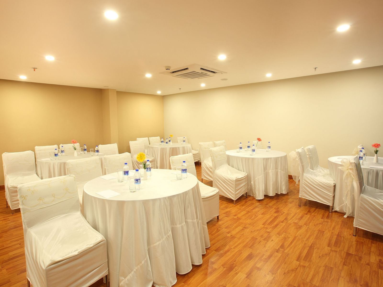 Round table seating inside the Banquet - Starlit Suites, Kochi