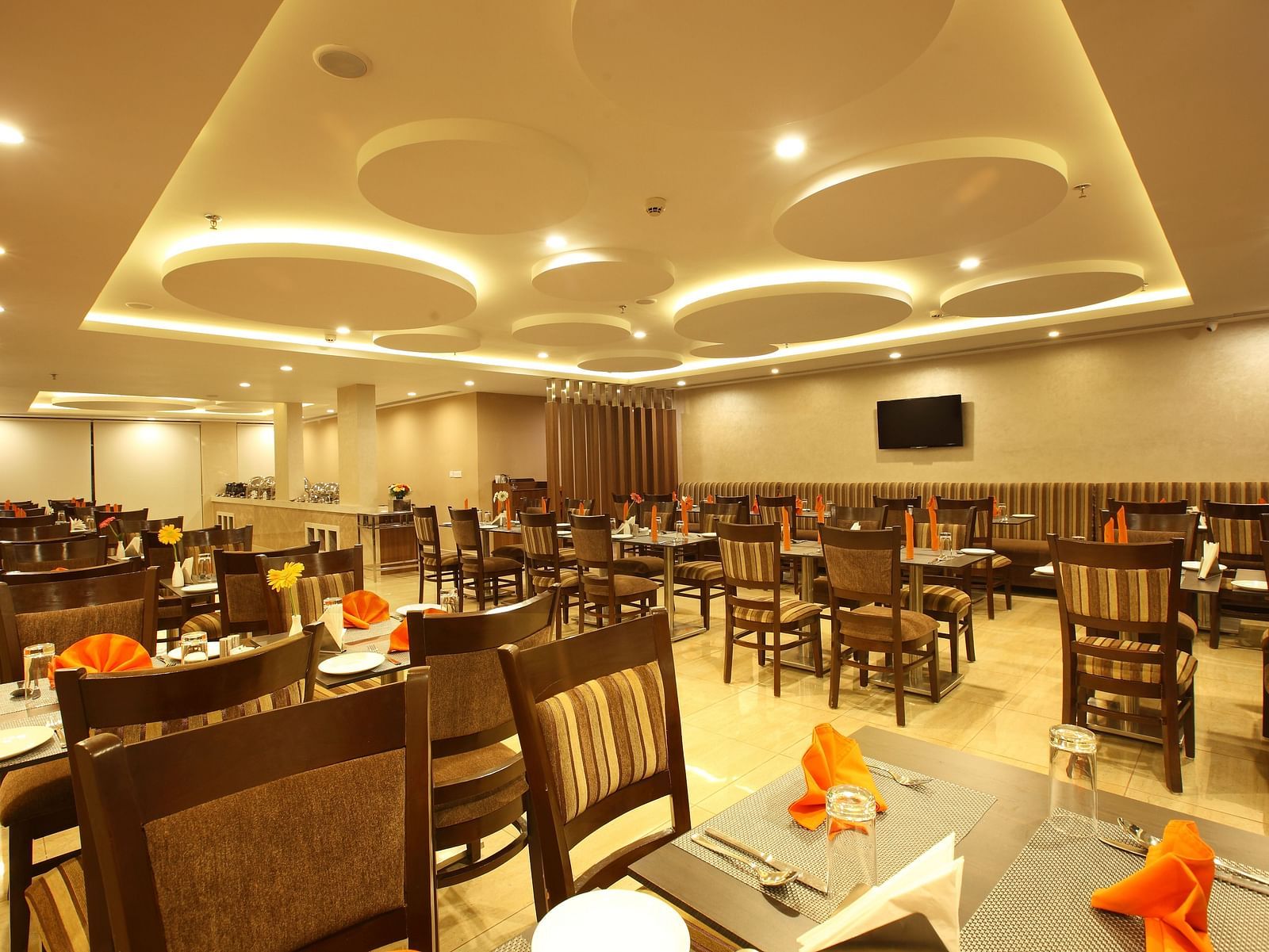 Seating arrangements inside the Gourmet Restaurant - Starlit Suites, Kochi