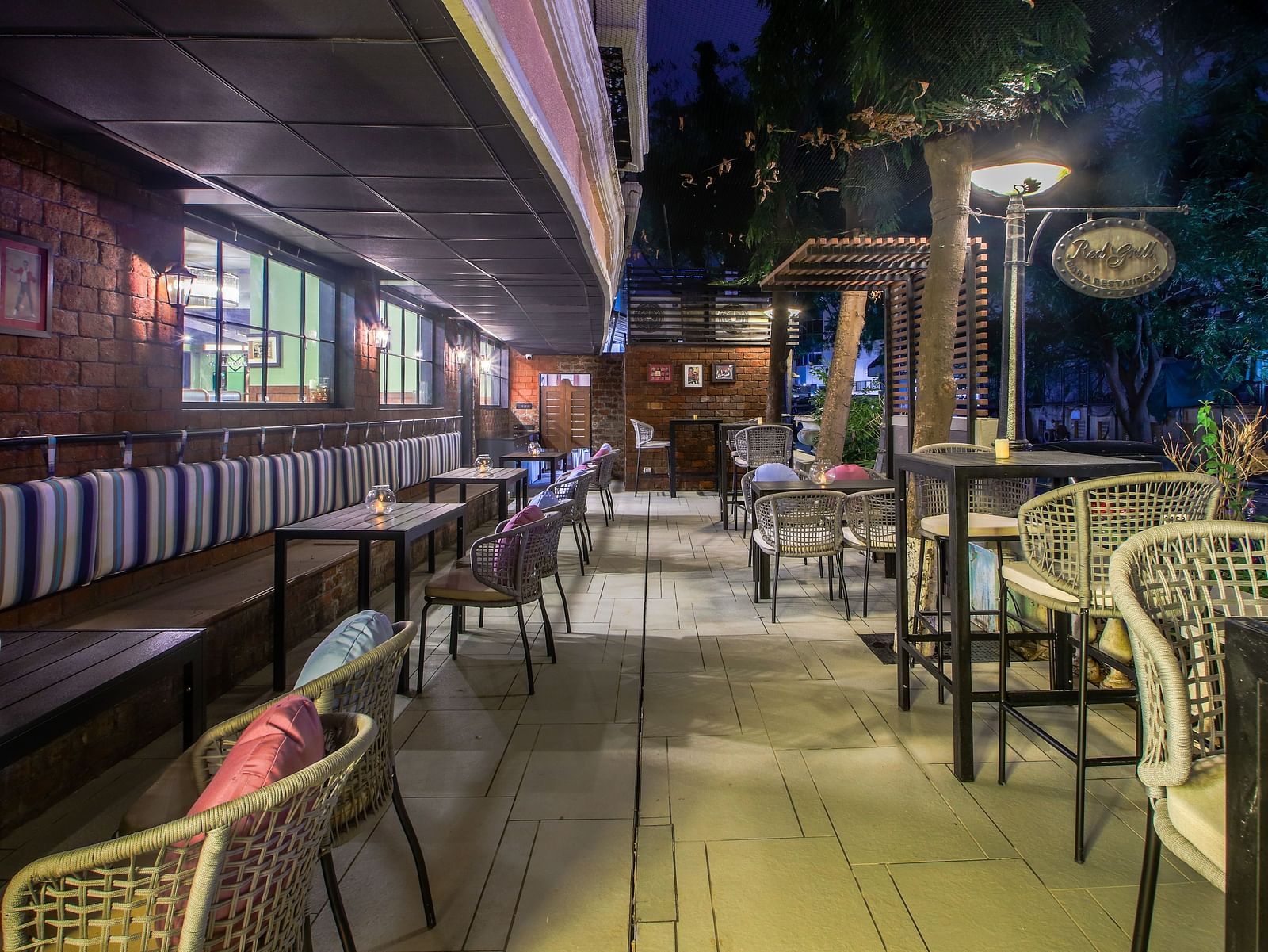 A cosy outdoor seating area with tables and chairs, perfect for enjoying a drink under the stars  | T24 Retro