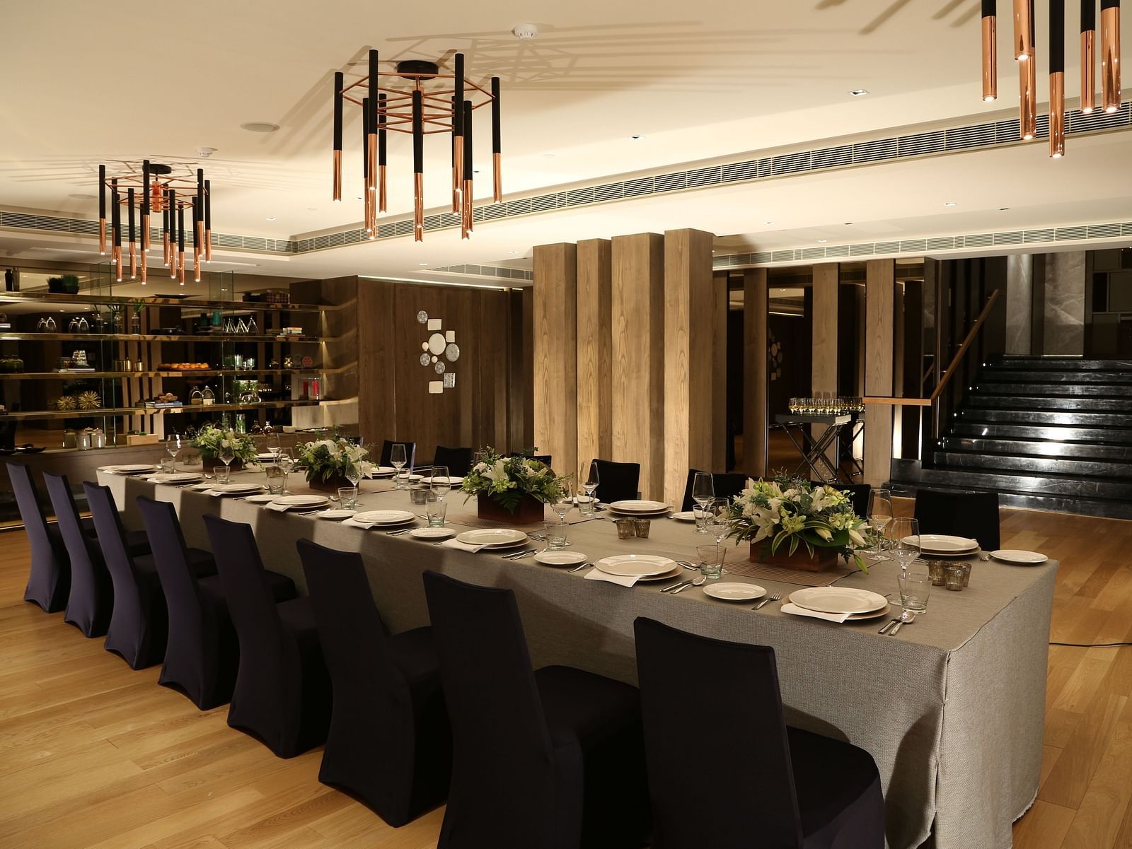 A sophisticated dining space with modern decor, offering a premium experience at The Raintree, St. Mary's Road.
