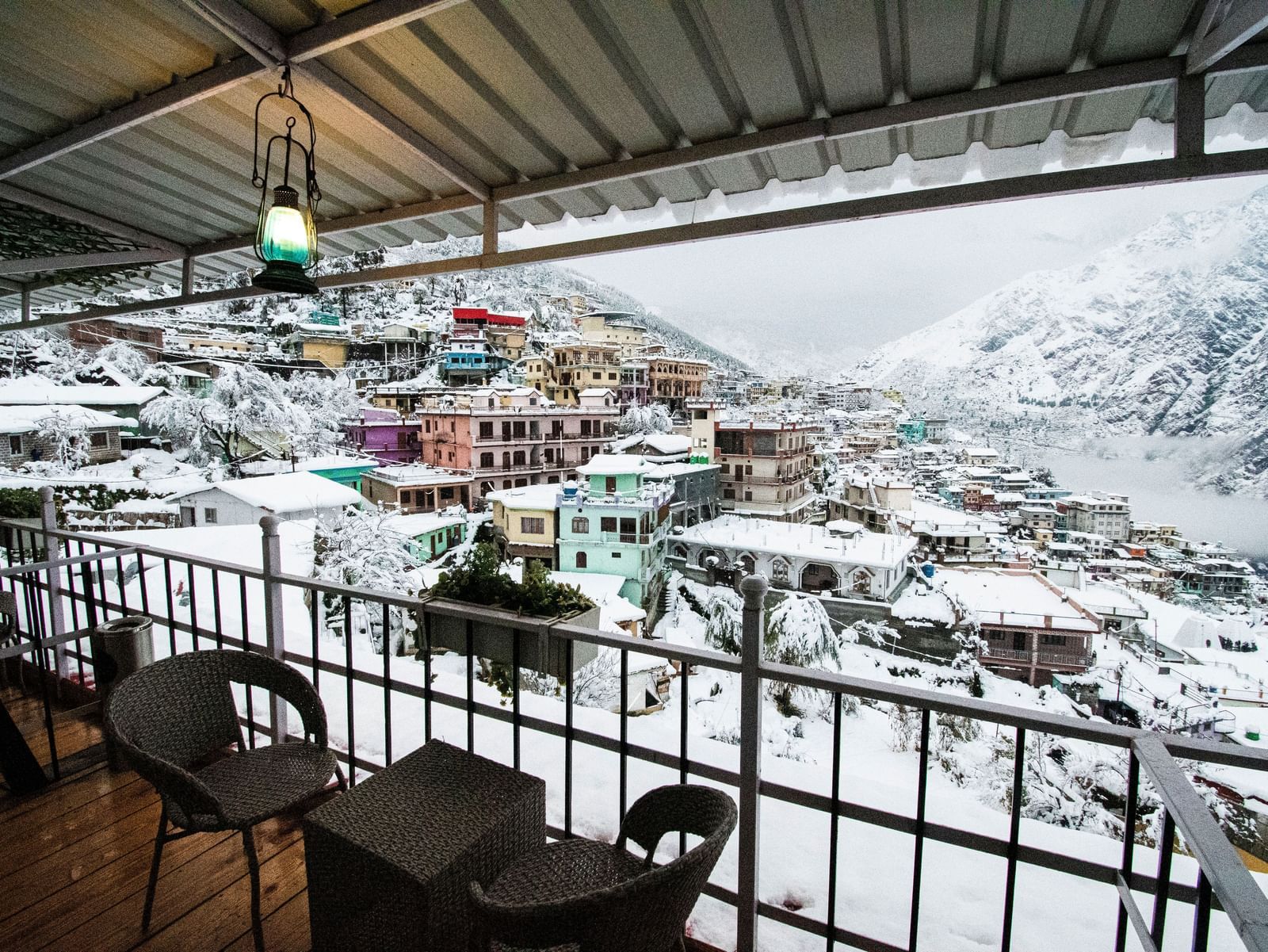 image of the city views on a snowy day with a think blanket of white snow covering everything - The Tattva, Joshimath